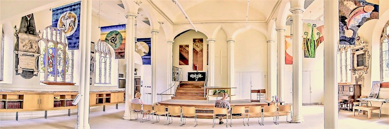 The light-filled interior of St Stephen&rsquo;s Church, hung with banners