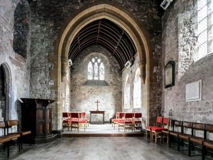 The stone interior of St Pancras&rsquo; church, looking towards the altar